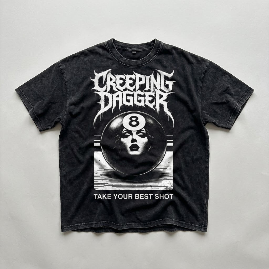 8-Ball Lady Snow Washed Oversized Tee in washed black, natural flat lay with Creeping Dagger graphic and Take Your Best Shot text