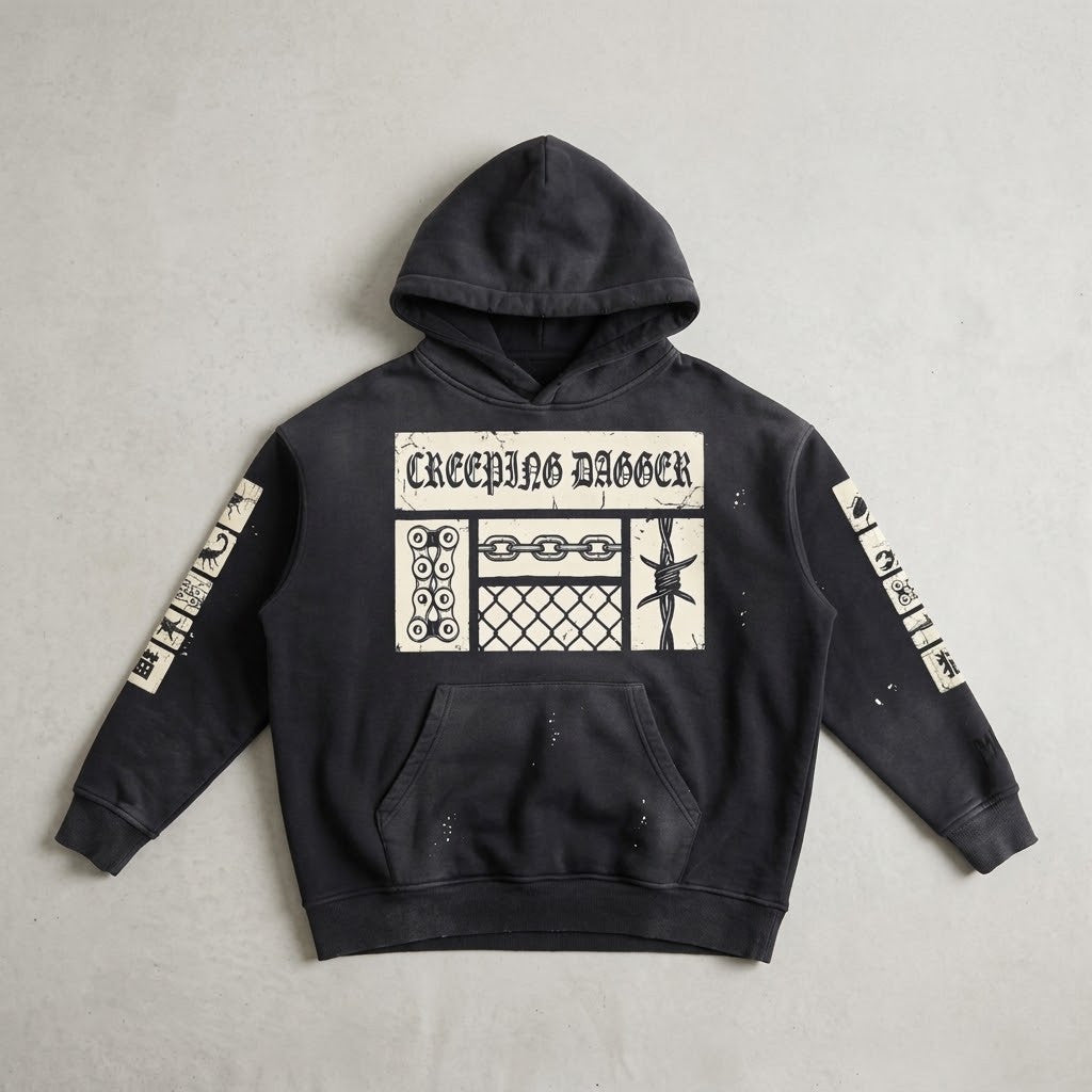 Creeping Panel Vintage Washed Frayed Hoodie in washed black, front patch panel and sleeve patches, laid flat on a light surface