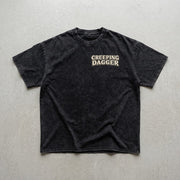 Fire Frog snow-washed oversized black tee, front with Creeping Dagger chest logo