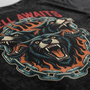 Close-up of the Hell Awaits tee's three-headed wolf print, flames and chains on washed black fabric