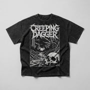 Post-Apocalypse Snow Washed Oversized Tee in washed black, front Creeping Dagger skull and ruins graphic