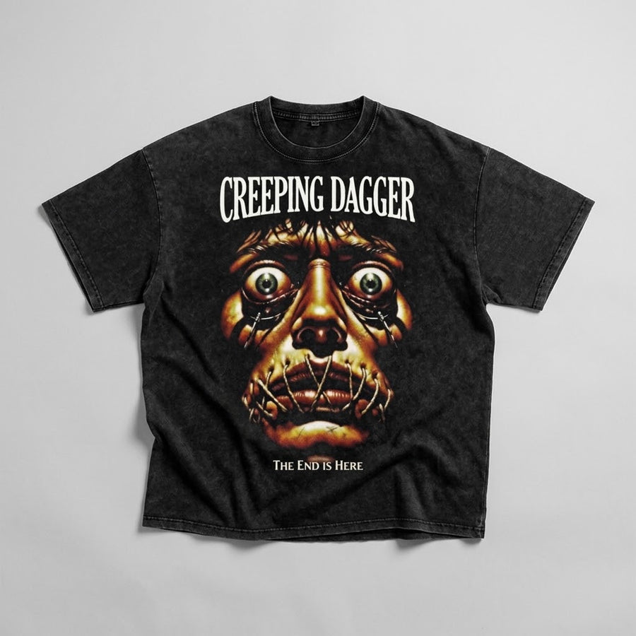 The End Is Here Snow Washed Oversized Tee, black flat-lay front with stitched-face horror graphic